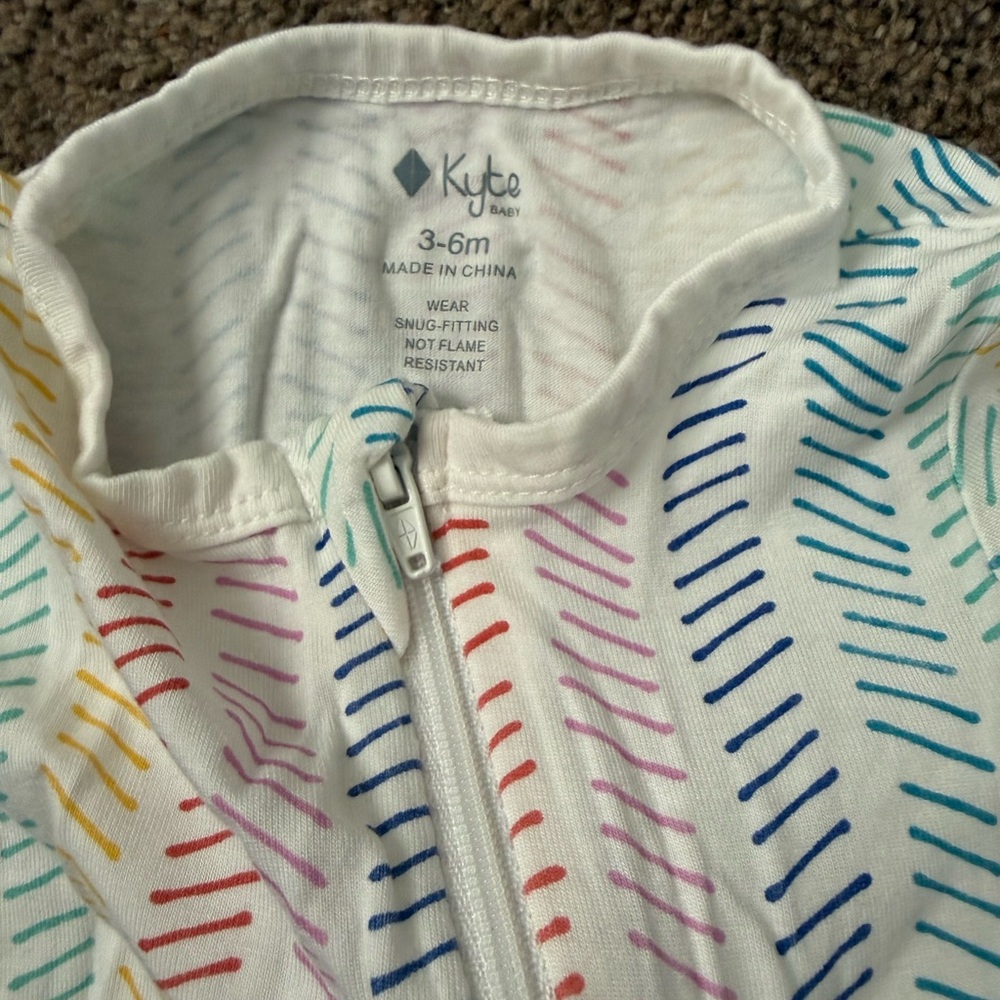 Kyte Baby Rainbow Herringbone long sleeve zip romper